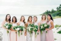 mismatched blush, lilac and pink maxi bridesmaid dresses for a bright or pastel beach or tropical wedding