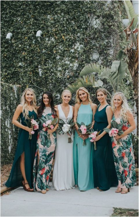 mismatched bridesmaid maxi dresses – with floral prints, in dark green and light blue with different necklines