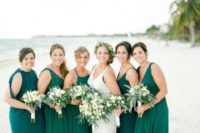 mismatched emerald maxi bridesmaid dresses and a teal one for the maid of honor for a tropical wedding
