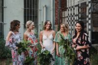 mismatched floral bridesmaids’ dresses in green, lavender, black and white with bold floral prints