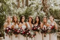 mismatched ivory and blush bridesmaid maxi dresses with ruffles in various places