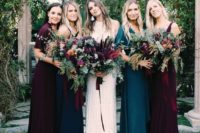 mismatched plum-colored and teal dresses of different designs look very spectacular and bold