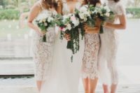 mismatched white lace midi bridesmaid dresses with various necklines for a tropical wedding