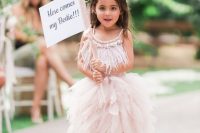 a blush midi flower girl dress with an embellished feather bodice and a layered skirt plus gladiator sandals for a bold look