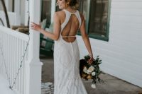 a fabulous boho lace mermaid wedding dress with a halter neckline, a keyhole back, a short train is a fantastic solution