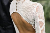 a modern boho lace fitting wedding dress with a keyhole back on buttons, long sleeves and a high neckline is a bold solution for a boho wedding