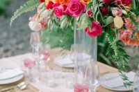 a neutral wedding tablescape with orange napkins and super bold blooms is a fantastic idea to enjoy color