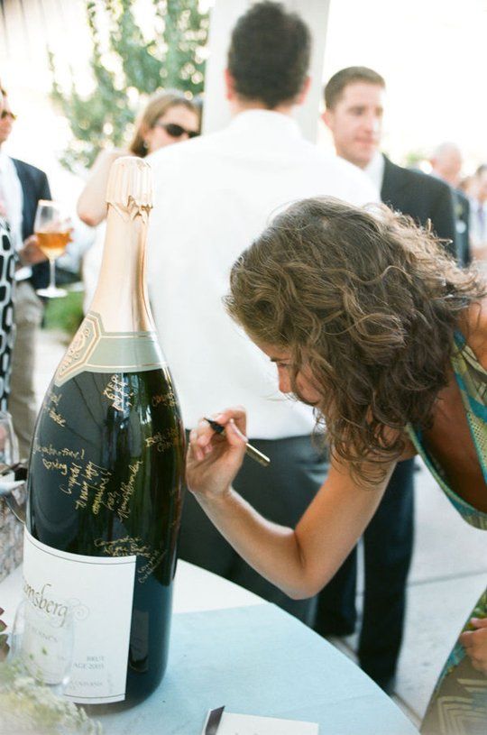an oversized bottle or several ones can be taken home after the wedding and you can read all the wishes