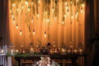 candle lanterns, floating candles and hanging bulbs create a magical and beautiful look in the space