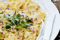 mushroom, ricotta, and goat cheese ravioli with edible flowers are a gorgeous wedding dish