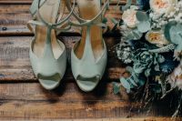 vintage mint-colored wedding shoes with T-straps are a soft touch of color and chic