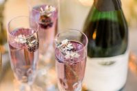 wedding drinks accented with edible blooms and fresh berries are delicious and romantic