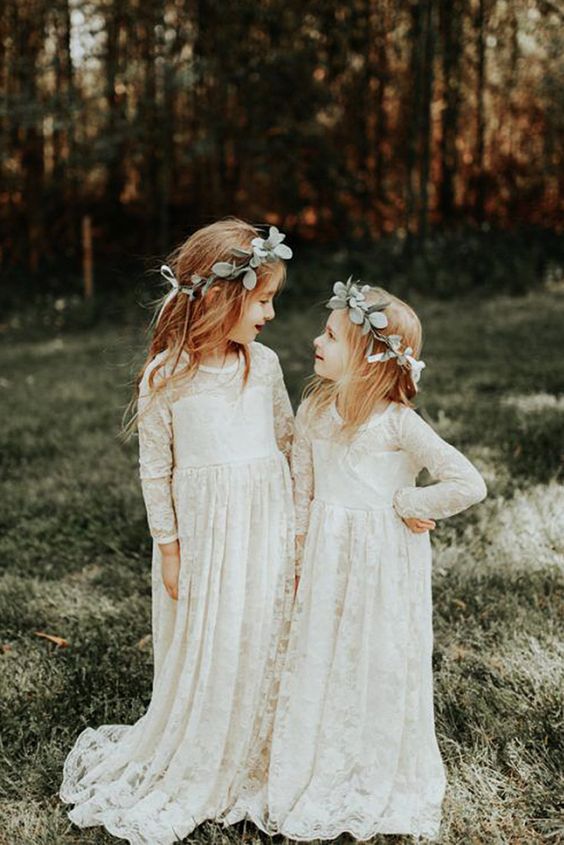 white lace maxi dresses with trains and long sleeves plus greenery crowns for a boho wedding