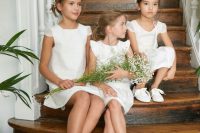white mini dresses with cap sleeves and a scoop neckline, white sneakers are perfect for a casual wedding