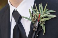 a Darth Vader wedding boutonniere with much greenery is ideal for Star Wars or for a groom who is a big fan