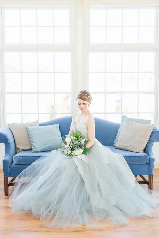 a beautiful pale blue strapless wedding dress with an embellished bodice and a layered tulle skirt is just wow