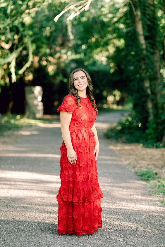 a beautiful red boho lace applique wedding dress with a high neckline, short sleeves and a tiered skirt for a boho wedding