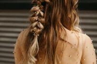a beautiful wedding half updo with a twisted loose braid and waves down, with fresh blooms tucked in is a gorgeous idea for a romantic bride