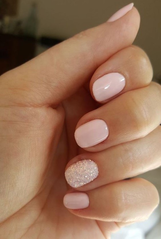 a blush wedding manicure and a white glitter accent nail for a winter or just glam bride