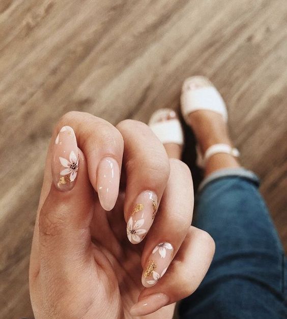 a blush wedding manicure with gold foil and white painted flowers is a lovely idea for a spring or summer wedding