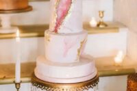 a chic pink marble and rose quartz wedding cake with gold leaf will make your guests wow