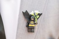 a creative Lego Batman wedding boutonniere with blooms for a groom who feels a superhero
