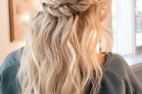 a double braid halo with wavy locks down for a romantic and relaxed or boho look