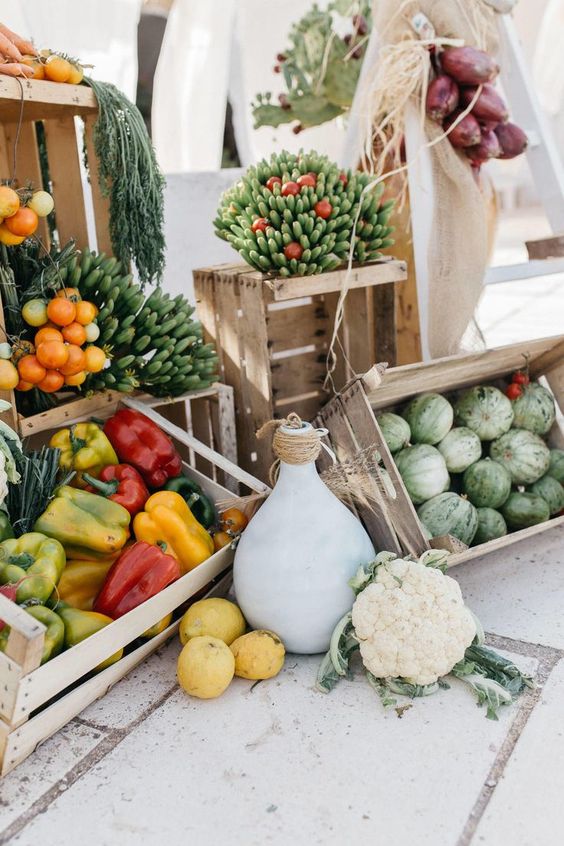 a farm fresh veggie station with olive oil and some dips is an amazing idea for a farmhouse or backyard wedding