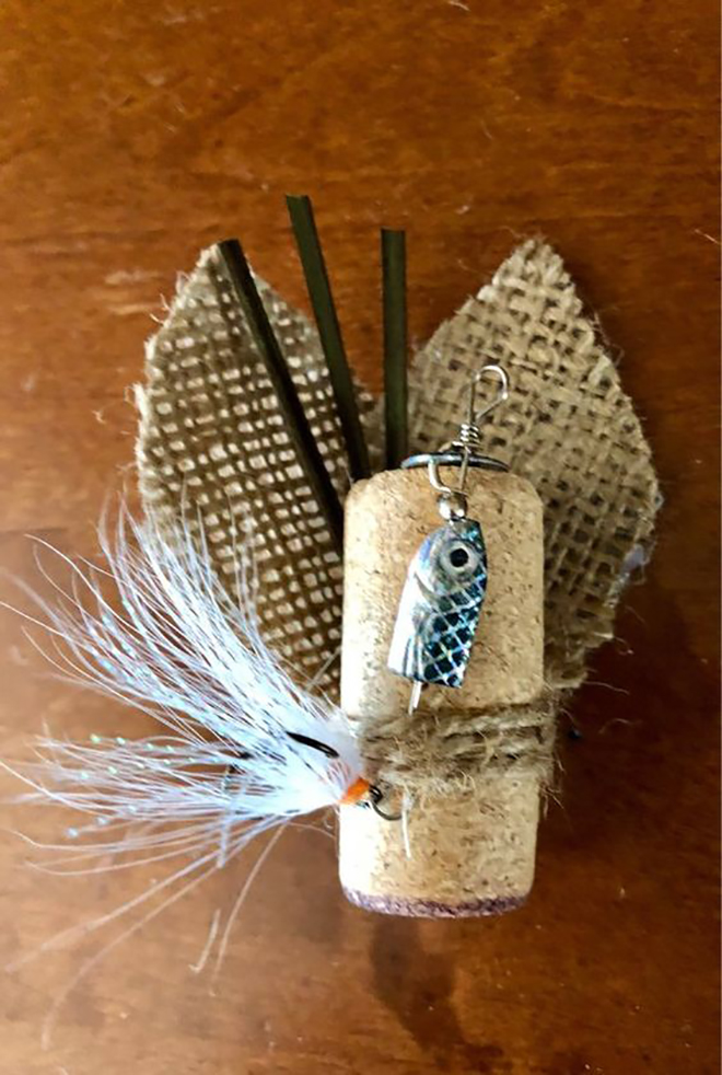 a fishing boutonniere of a cork, burlap, sticks and fishing accessories is a lovely idea for a groom who enjoys fishing