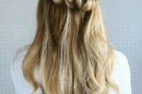 a half up pull through braided hairstyle is a stunning idea to try if your hair is long enough