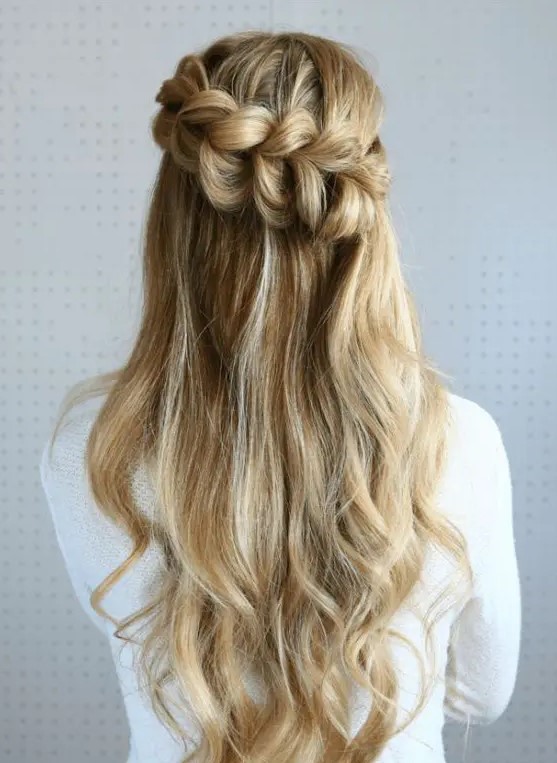 a half up pull through braided hairstyle is a stunning idea to try if your hair is long enough