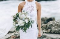 a lace illusion halter neckline wedding dress with a front slit is a very sexy and very bold idea for a boho beach bride