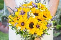 a laid-back rustic wedding bouquet of sunflowers, lavender, daisies and greenery plus evergreens is easy to make yourself