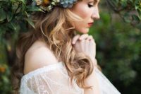 a lovely floral and succulent crown with billy balls is a cool accessory for a boho bride