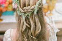 a lovely half updo with a braided halo and waves down, with some grasses is a beautiful solution for a summer or fall bride
