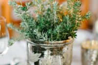 a mercury glass urn with greenery is a chic and simpel centerpiece idea