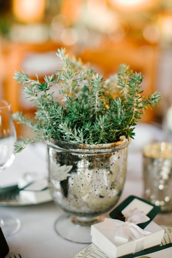 a mercury glass urn with greenery is a chic and simpel centerpiece idea