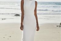 a minimalist white sheath dress with a high neckline and no sleeves is an ultimate idea for a modenr bride
