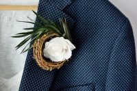 a nest boutonniere with a white rose and greenery is a stylish idea to rock at a spring or Easter wedding