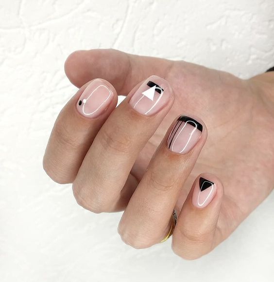 a nude, black and white boho wedding nail art like this one is non-obtrusive and very chic and looks cool