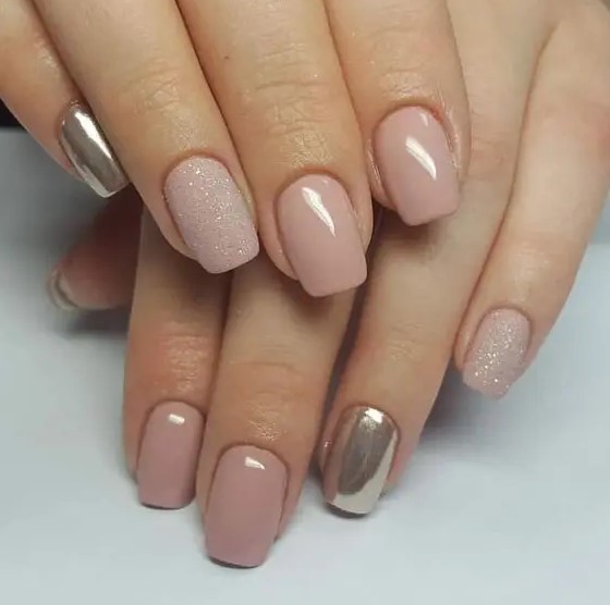 a nude manicure with a touch of glitter and silver nails for those who insist on a modern take on classics
