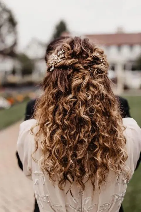 a pretty curly wedding half updo wiеh twists and embellished hair pieces and curls down is easy to make and looks amazing