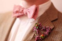 a pretty heart-shaped floral boutonniere with berries is a lovely idea to add a romantic touch to the look