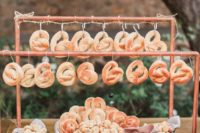 a pretzel bar with various kinds of dips is a trendy idea for any wedding