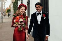 a lovely bride with a red dress and a red floral crown
