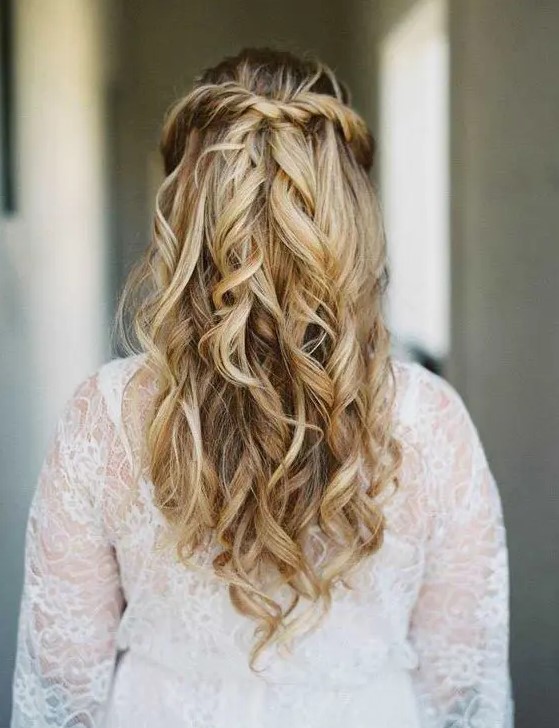 a twisted and wavy half updo is one of the hottest trends currently