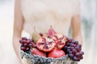a vintage silver bowl with grapes, pears and pomegranates for a decadent fall wedding