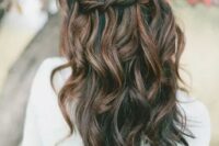 a wavy braided half updo with balayage is impressive and will be a fit for a boho bride