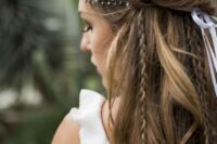 a whimsy and cool wedding hairstyle with a volume on top, a fishtail braid halo, some braids down and a rhinestone hairpiece