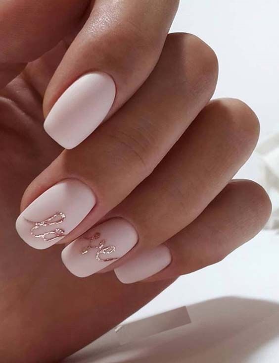 an icy pink wedding manicure accented with pink glitter calligraphy is a great idea for a wedding